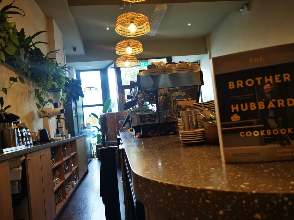 Brother Hubbard café in Ranelagh, Dublin, looking towards the street with bar seating, banquette and tables after the PP Construction fit-out