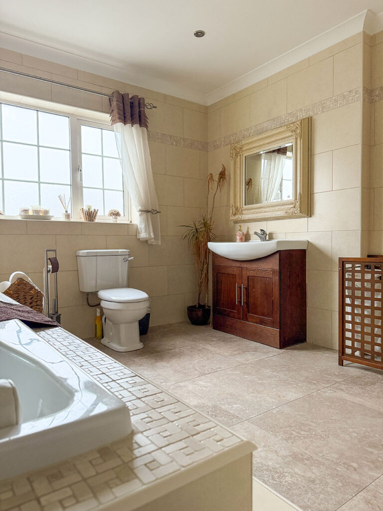 bathroom renovation Kildare with new bath, vanity and soft natural lighting