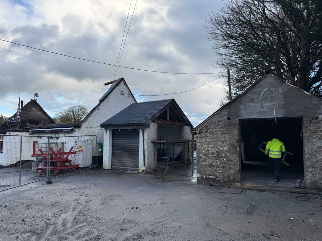 Yard at Fagan’s pub, Moynalvey, during the works, with the outbuildings being converted into the temporary bar
